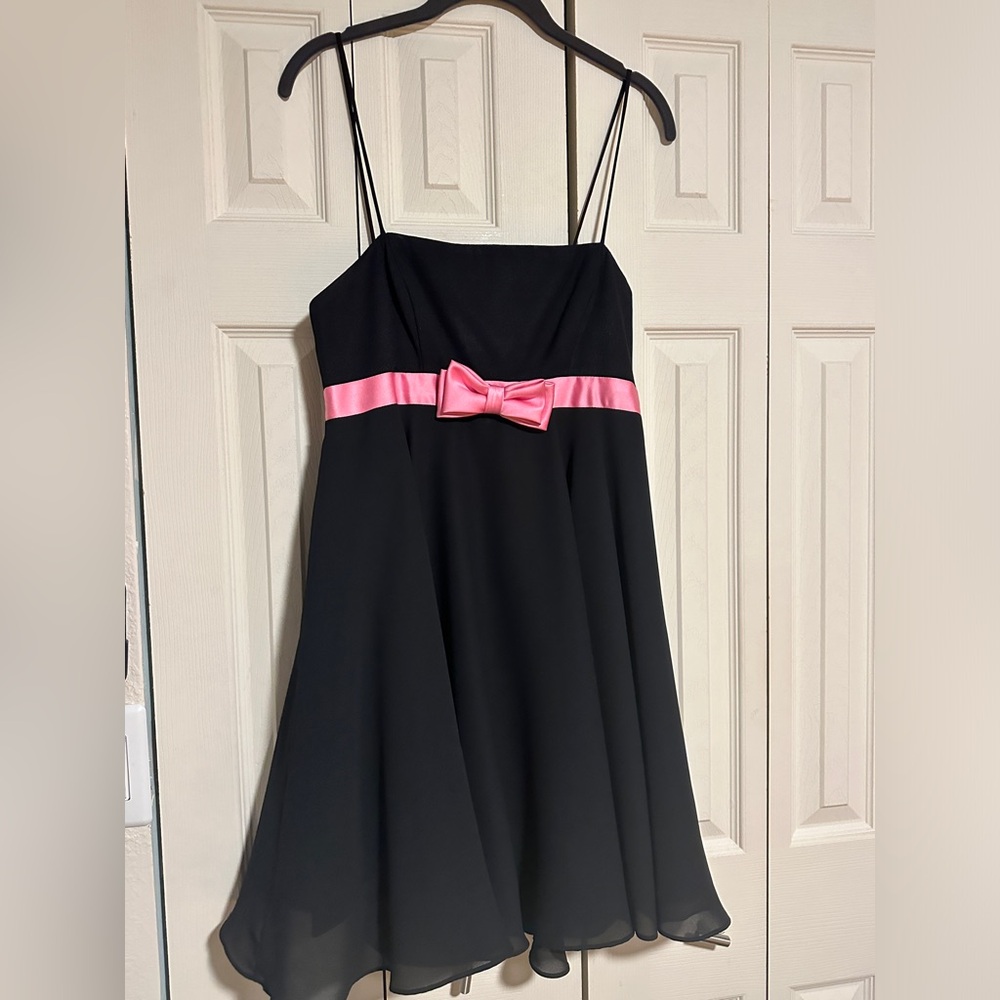 Black dress with pink bow. Size 11-12